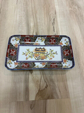 Toyo Ko Imari Japanese porcelain dish featuring intricate floral designs and a c